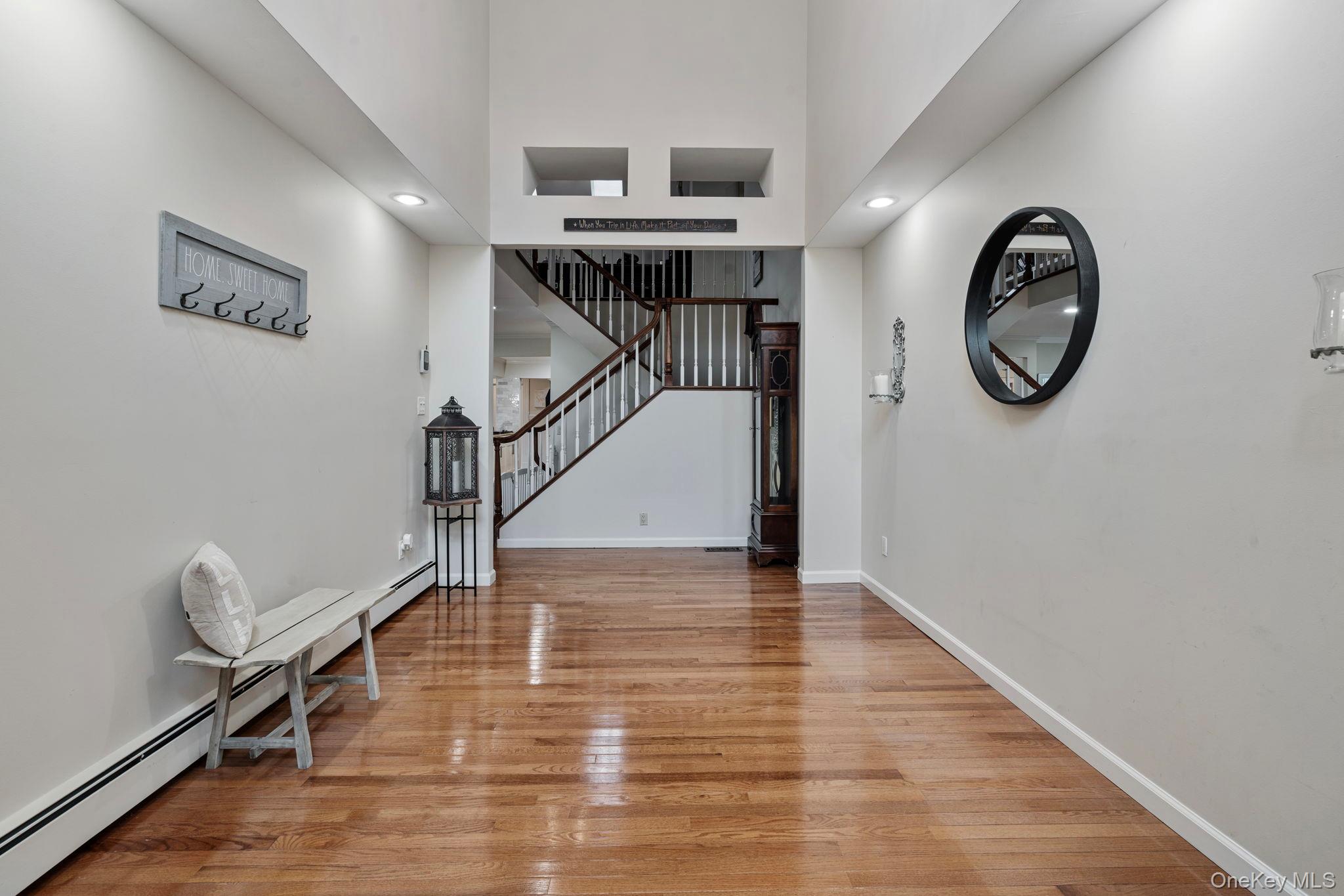 6 Daniel Way Setauket, NY 11733 - Photo 6 of 41 a view of entryway with wooden floor
