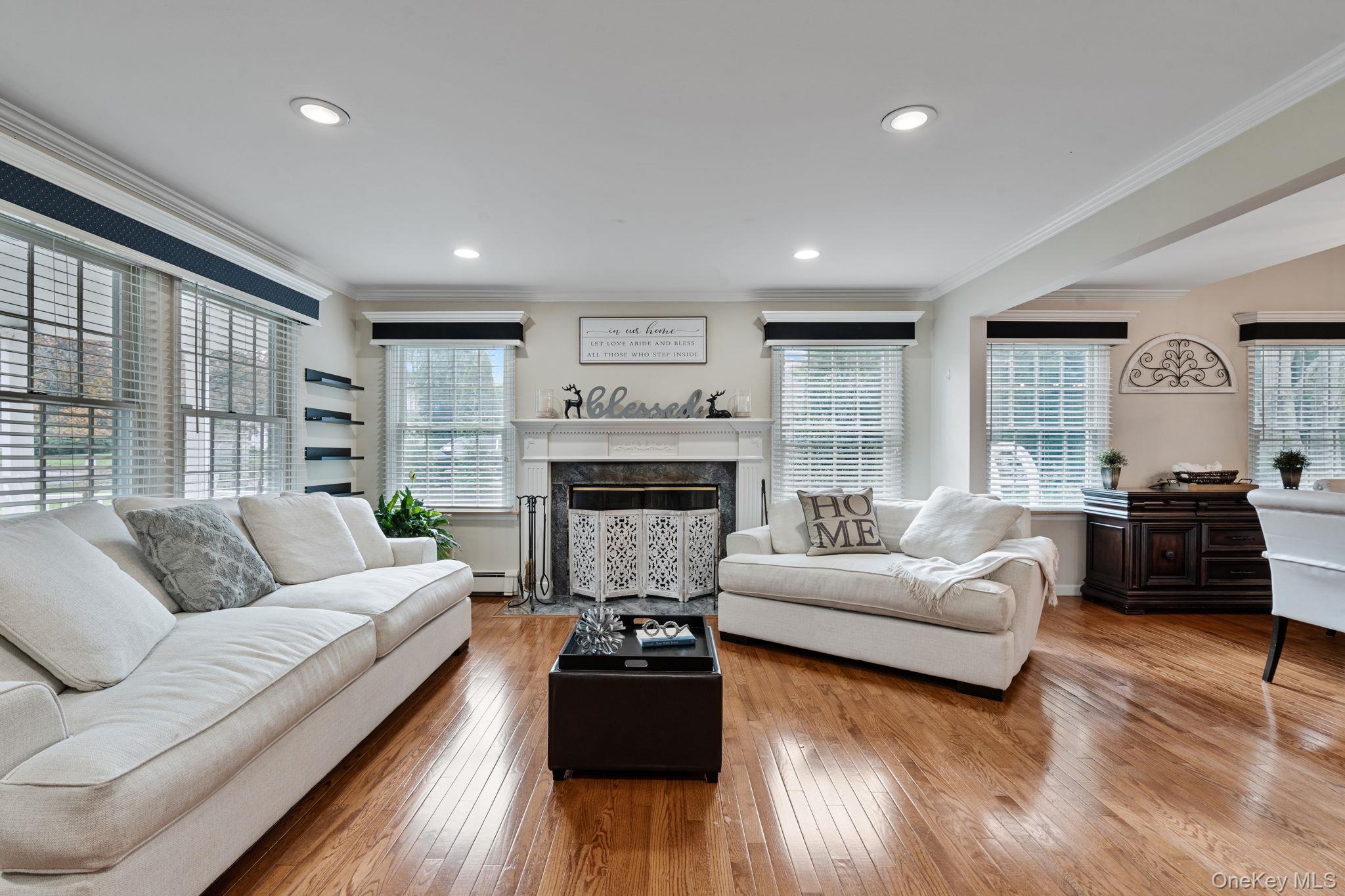 6 Daniel Way Setauket, NY 11733 - Photo 8 of 41 a living room with furniture and a fireplace