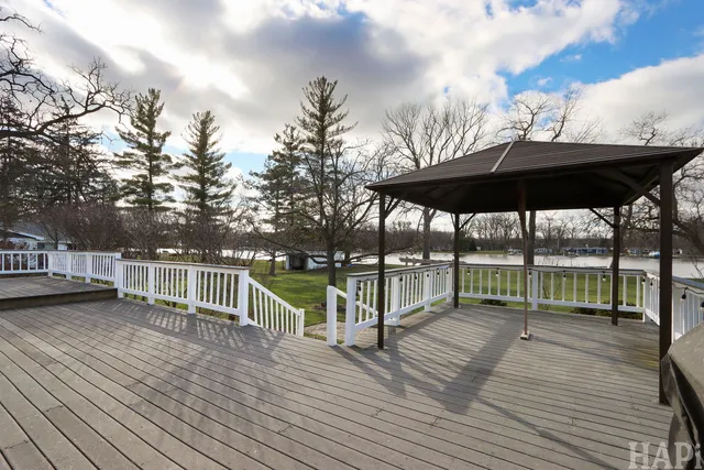 a view of a house with backyard and wooden floor