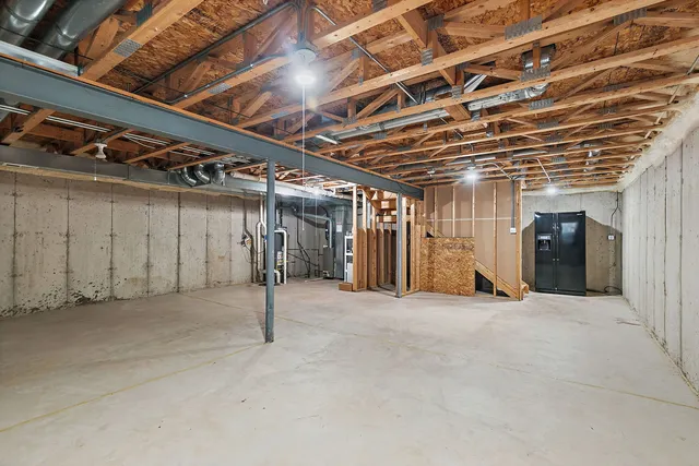 a view of empty room with wooden walls