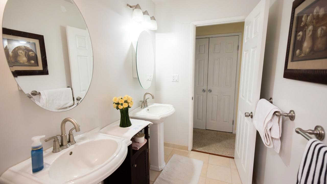 108 Stein Way Orinda, CA 94563 - Photo 11 of 40 a bathroom with a sink and mirror