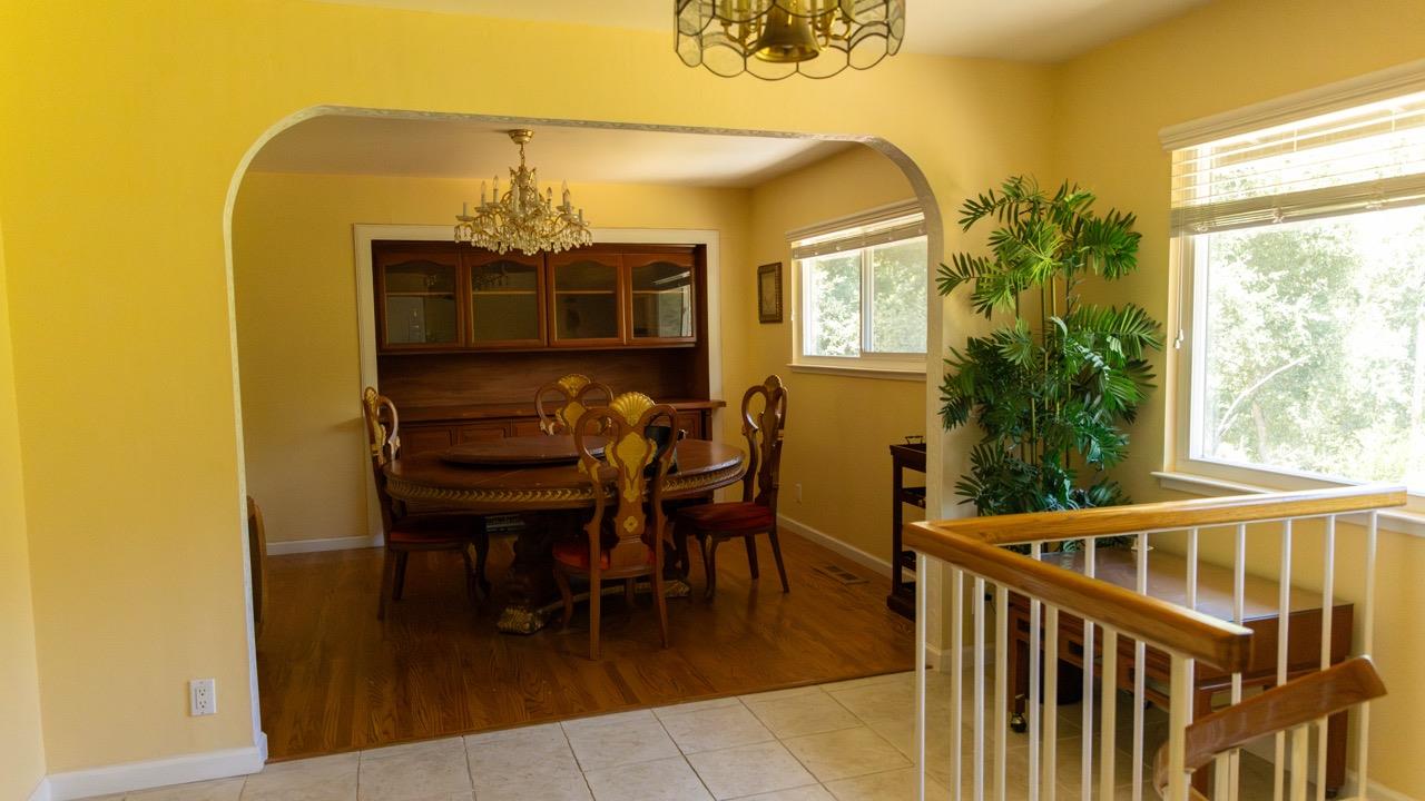 108 Stein Way Orinda, CA 94563 - Photo 12 of 40 a view of a dining room with furniture and a window