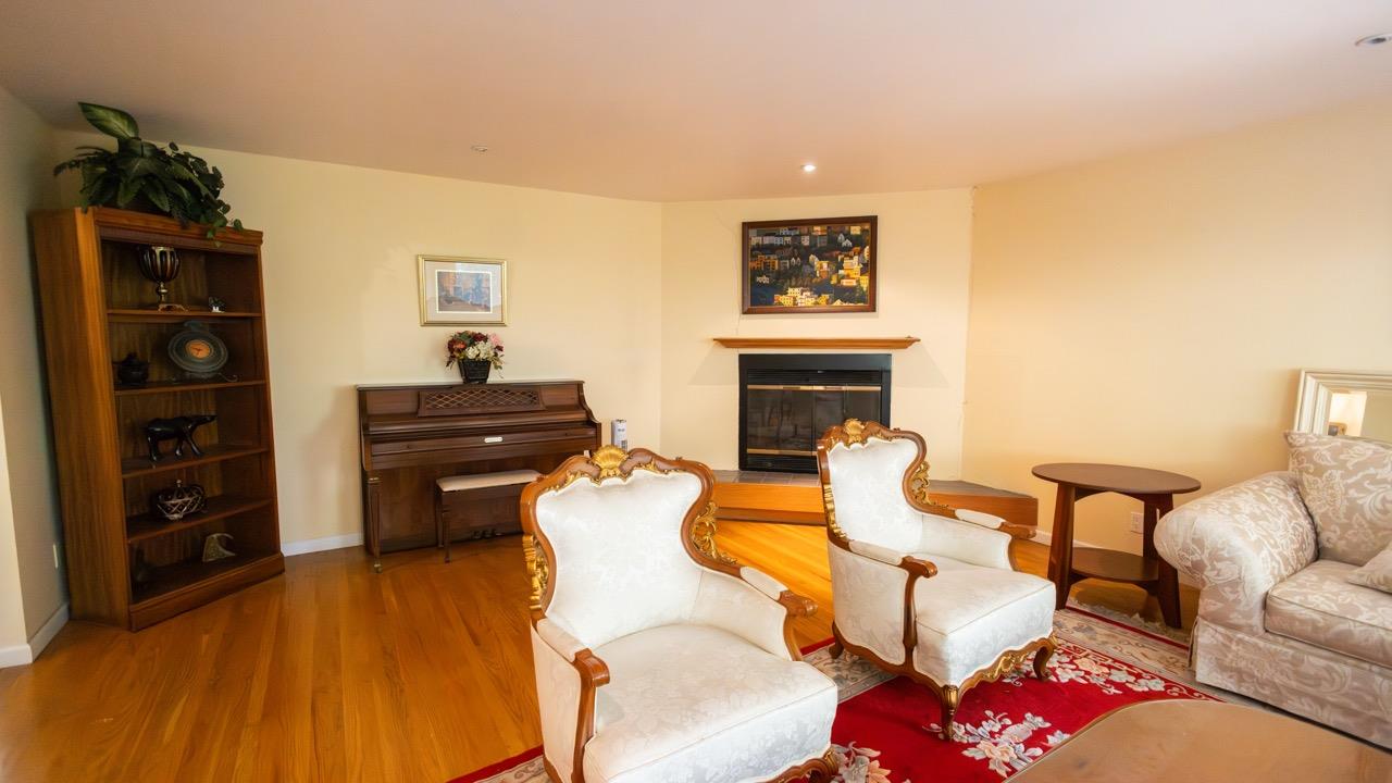 108 Stein Way Orinda, CA 94563 - Photo 28 of 40 a living room with furniture and wooden floor