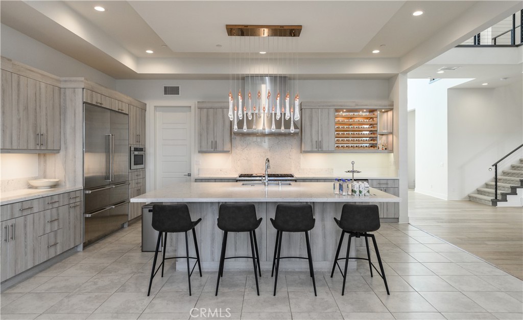 59 Dorado Irvine, CA 92618 - Photo 13 of 66 a kitchen with a sink and chairs