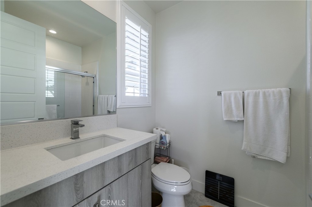 59 Dorado Irvine, CA 92618 - Photo 22 of 66 a bathroom with a sink toilet and a mirror