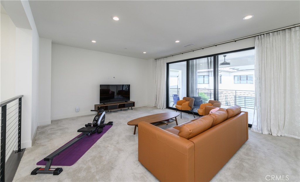 59 Dorado Irvine, CA 92618 - Photo 25 of 66 a living room with furniture and a flat screen tv