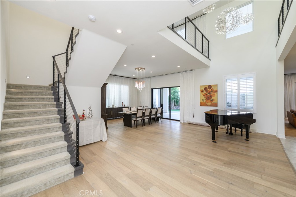 59 Dorado Irvine, CA 92618 - Photo 3 of 66 a view of dining room with furniture one side kitchen view and wooden floor