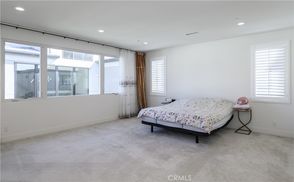 59 Dorado Irvine, CA 92618 - Photo 34 of 66 a bedroom with a bed and a large window