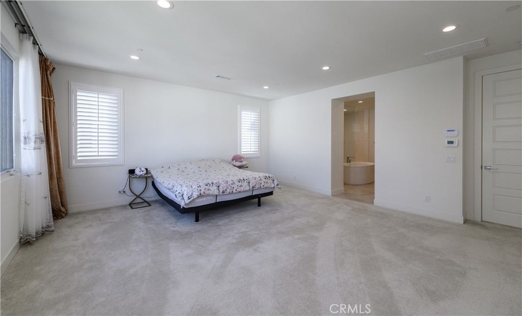 59 Dorado Irvine, CA 92618 - Photo 35 of 66 a spacious bedroom with a bed and a window