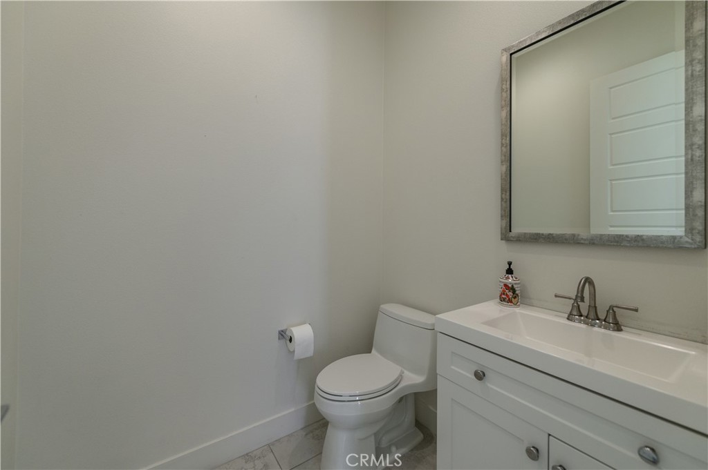 59 Dorado Irvine, CA 92618 - Photo 44 of 66 a bathroom with a toilet sink and mirror