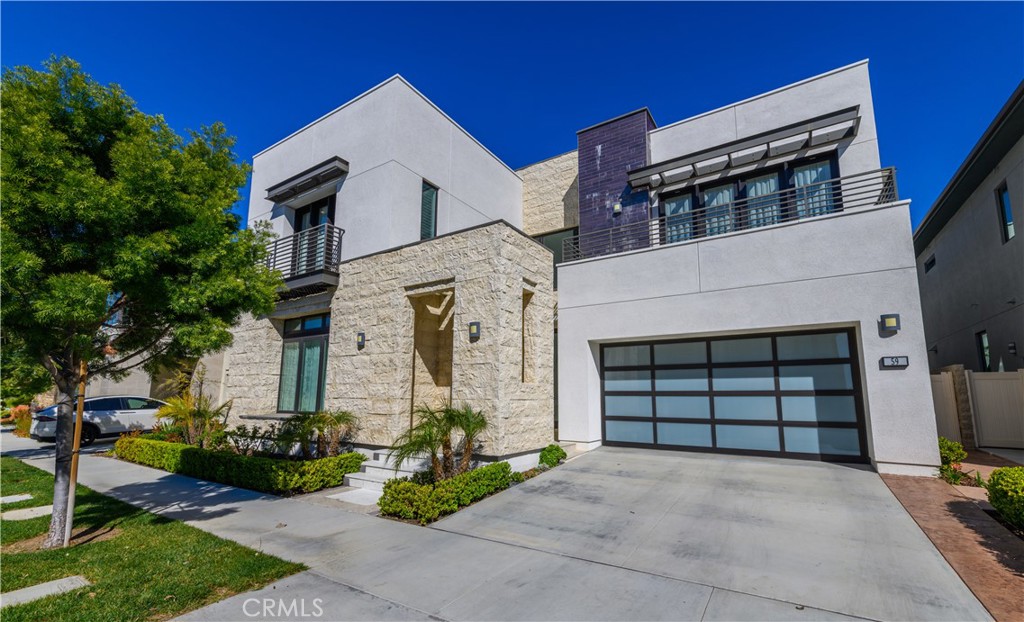 59 Dorado Irvine, CA 92618 - Photo 58 of 66 a front view of a house with a yard and garage