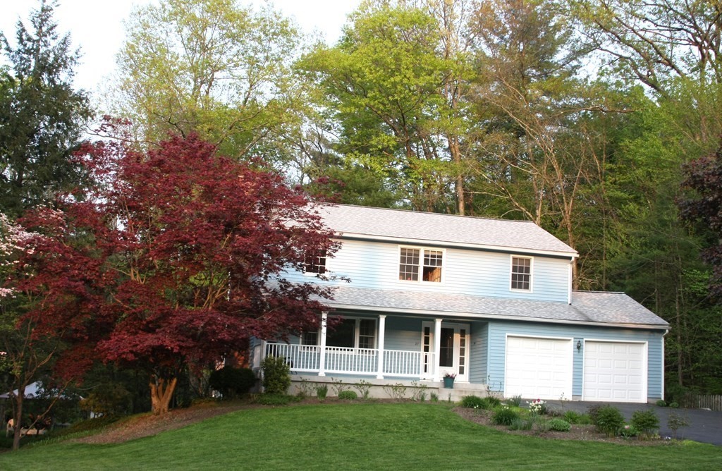 27 Elf Hill Road Amherst, MA 01002 - Photo 1 of 22 a front view of a house with a yard and trees