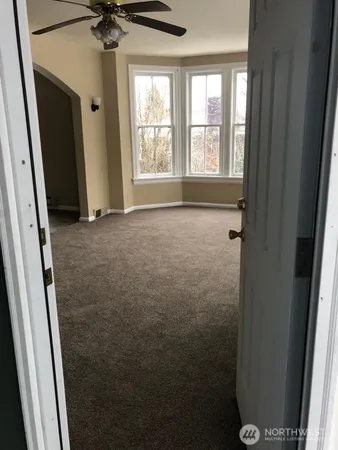 a kitchen with kitchen island a sink table and chairs