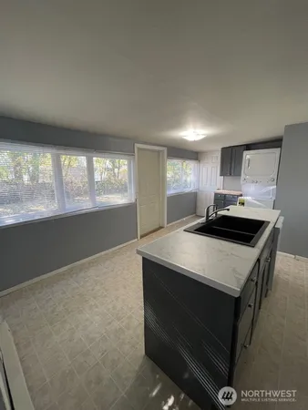 a kitchen with a refrigerator sink and stove