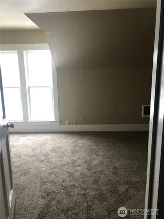 a view of an empty room and window