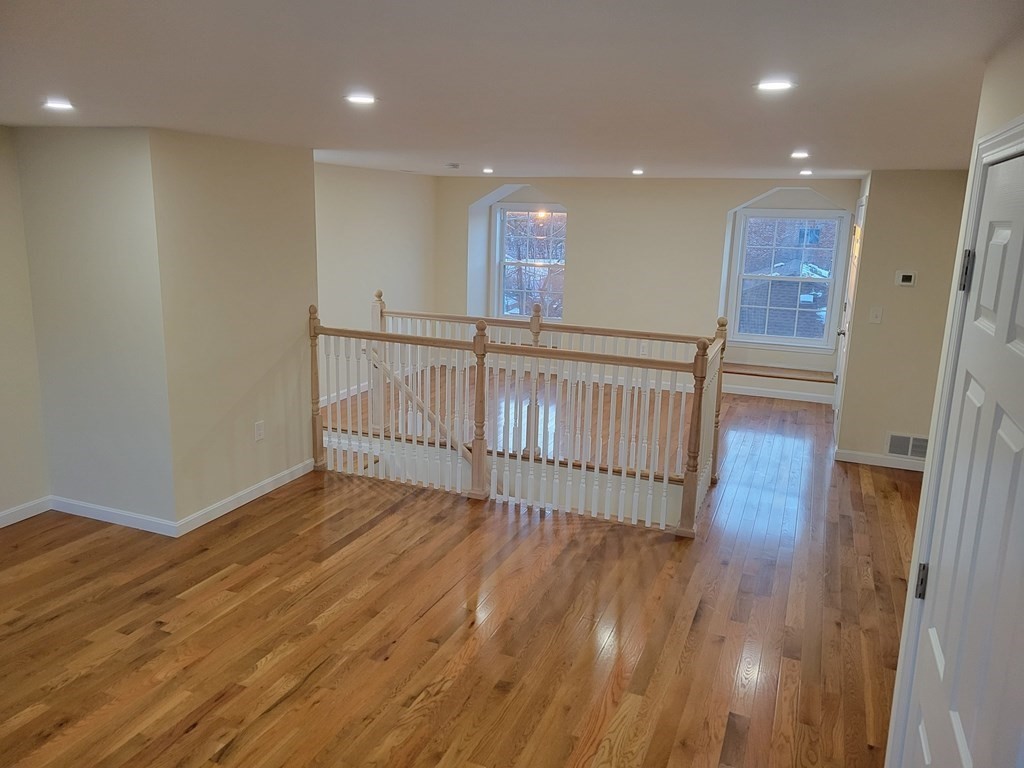 89 Devir Street Malden, MA 02148 - Photo 13 of 24 a view of a hallway with wooden floor
