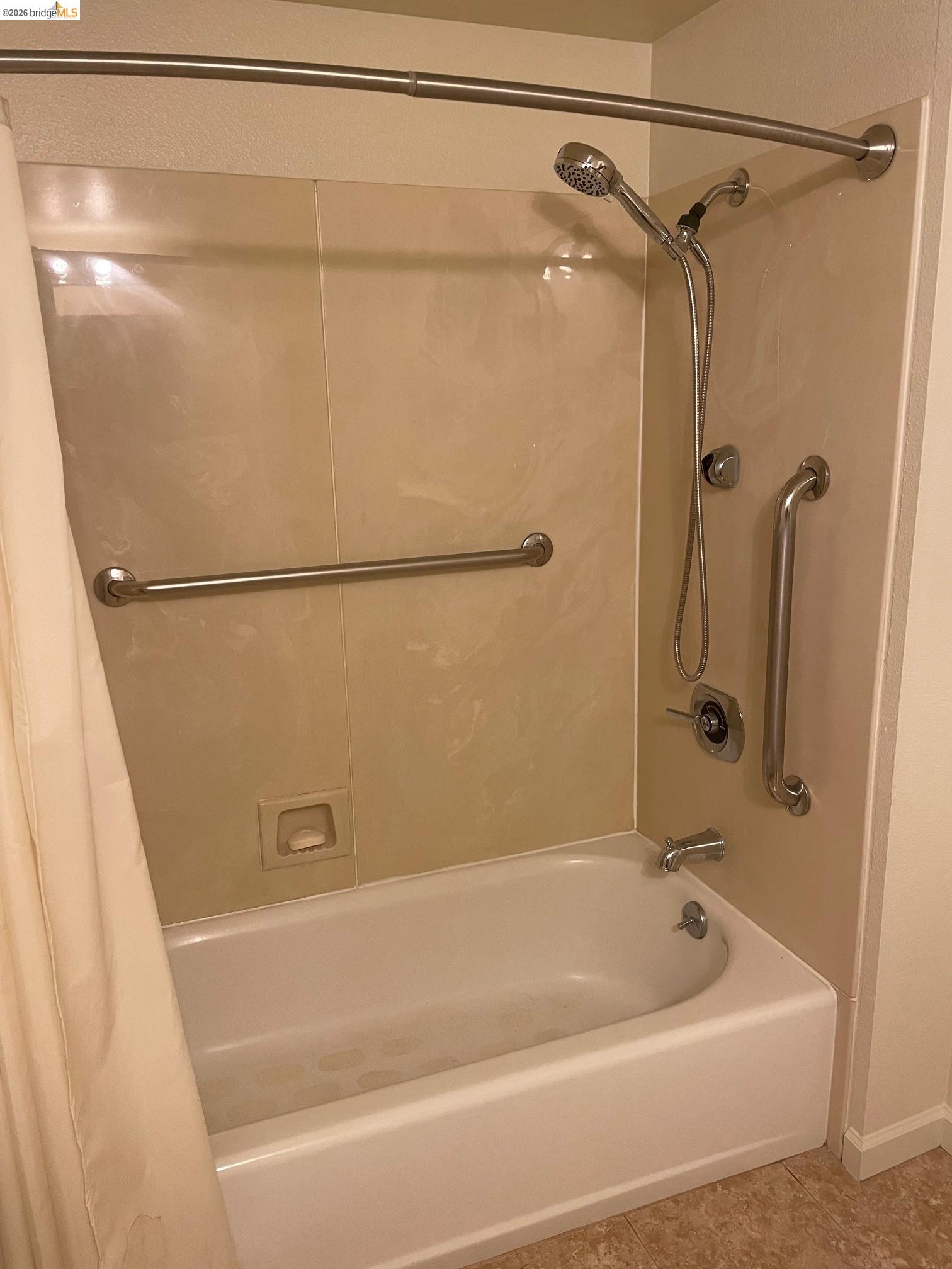 989 Webster Street, Unit 450 Oakland, CA 94607 - Photo 13 of 16 a bathroom with a bath tub and shower
