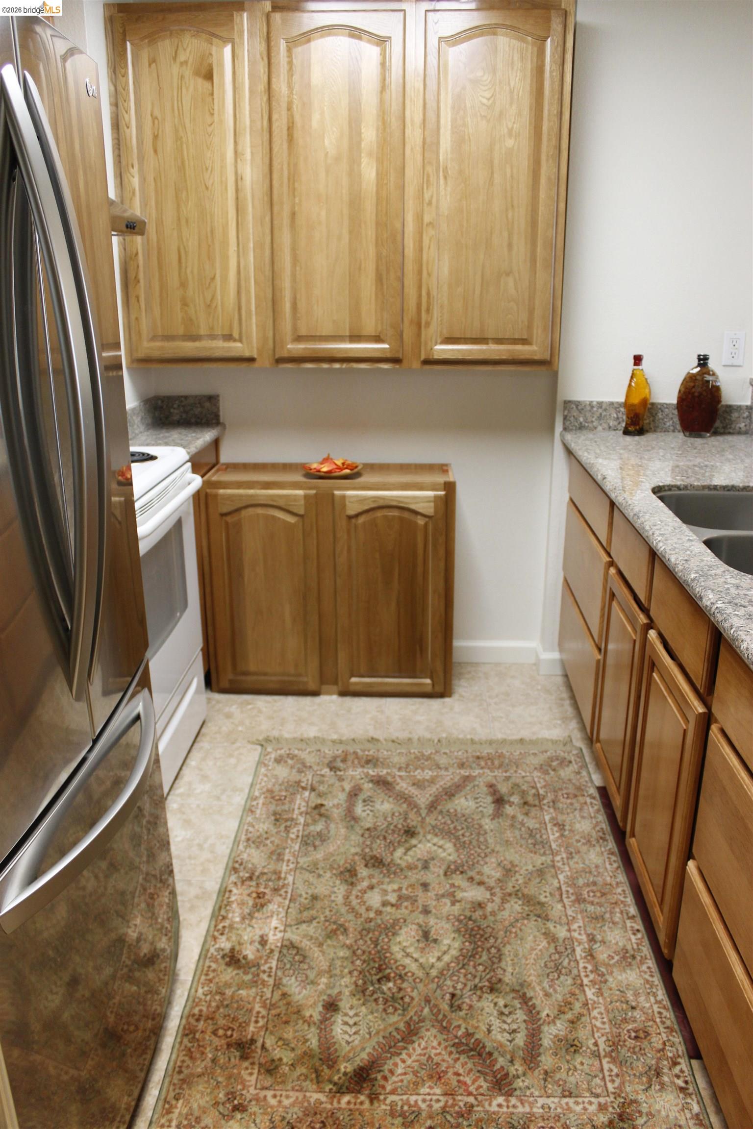 989 Webster Street, Unit 450 Oakland, CA 94607 - Photo 4 of 16 a bathroom with a sink a mirror and a shower