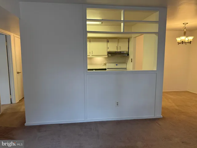 an empty room with a view of a bathroom