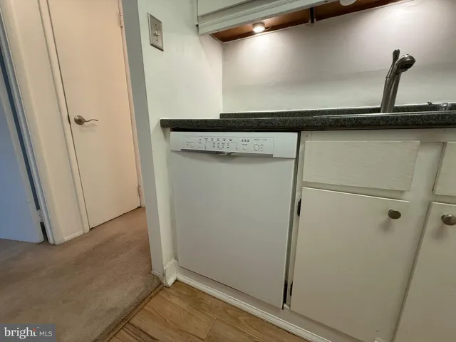 a stove top oven sitting inside of a kitchen