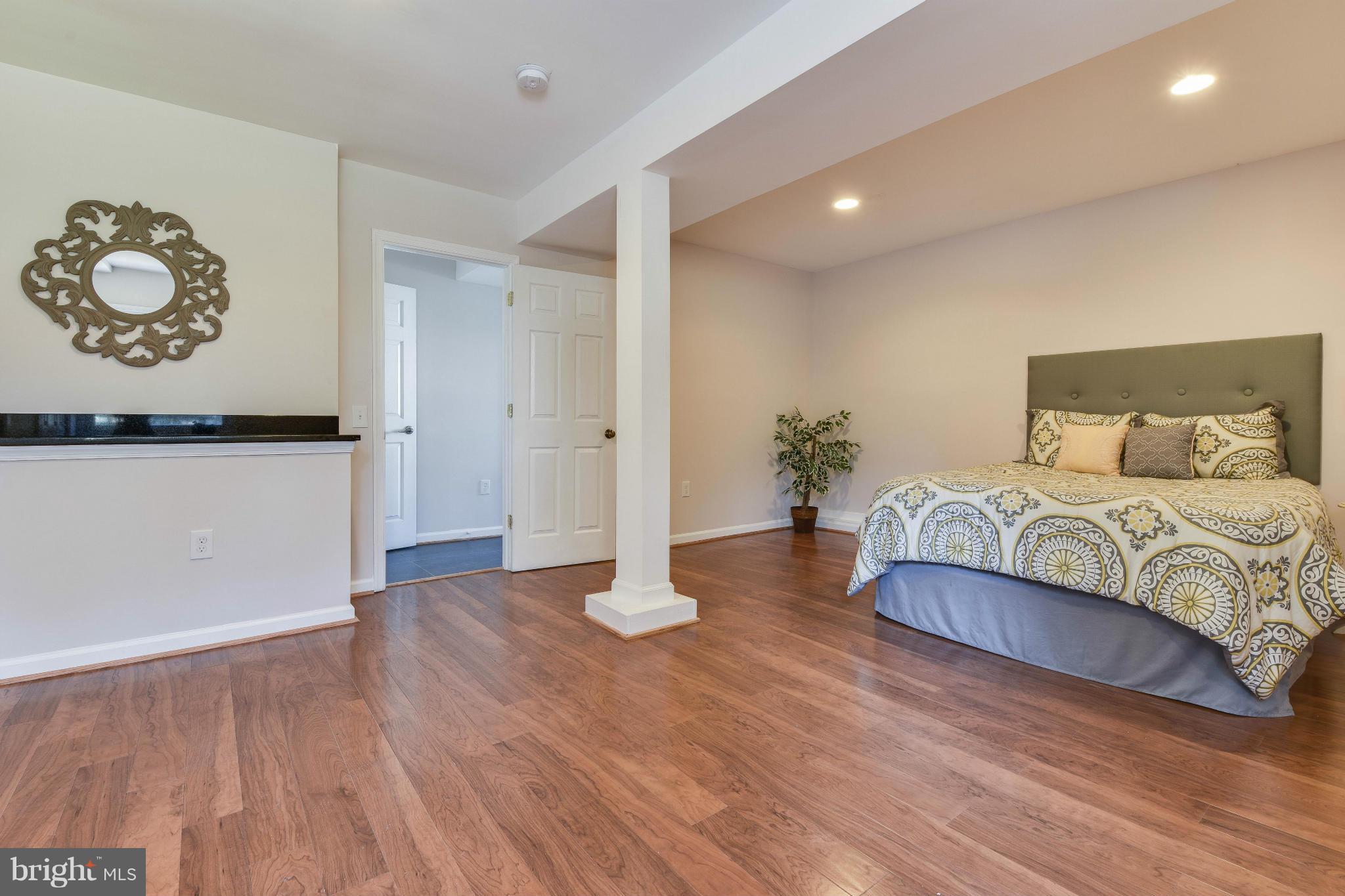 14001 Pond View Road Silver Spring, MD 20905 - Photo 13 of 30 a living room with furniture and wooden floor