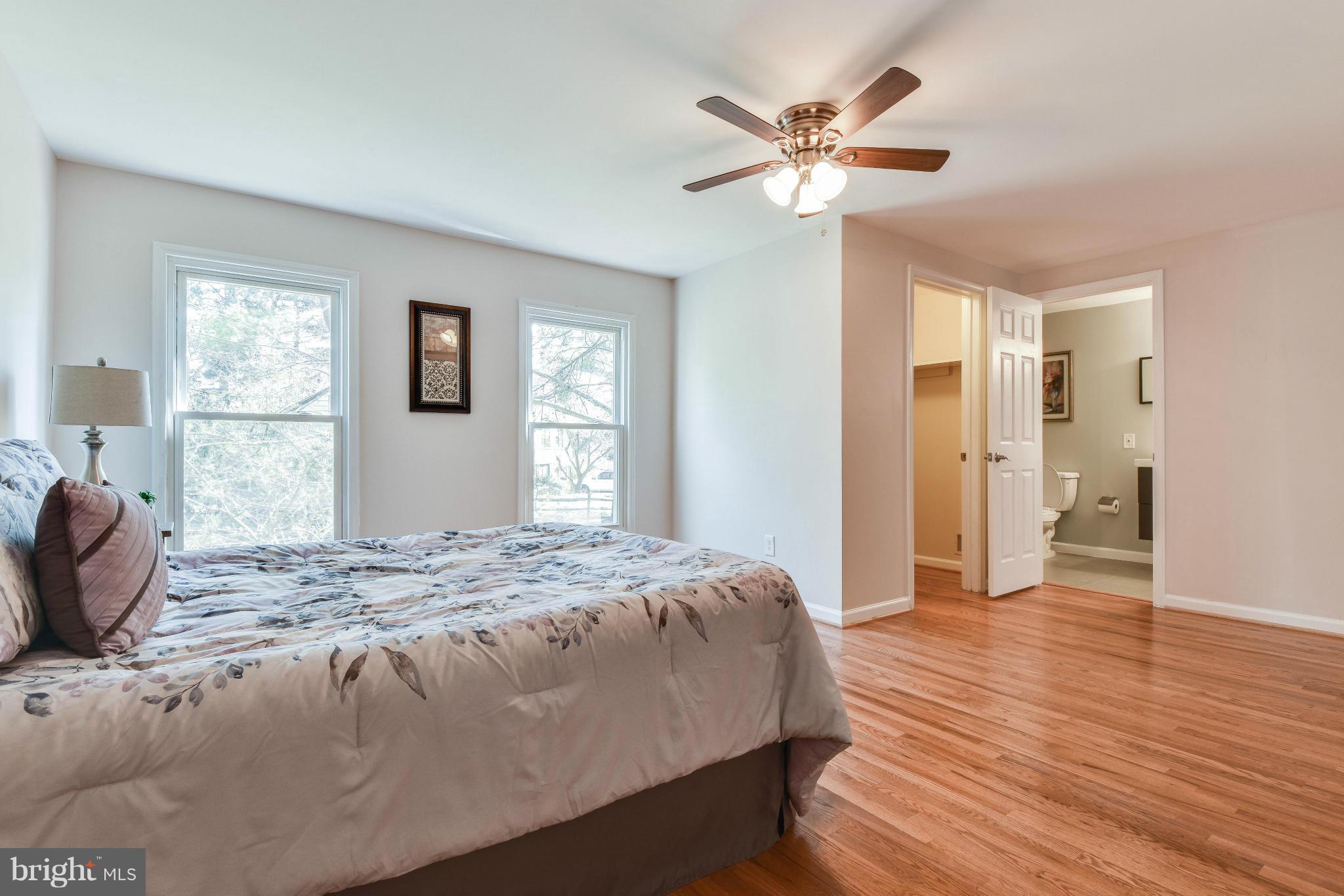 14001 Pond View Road Silver Spring, MD 20905 - Photo 16 of 30 a bedroom with a bed and a window