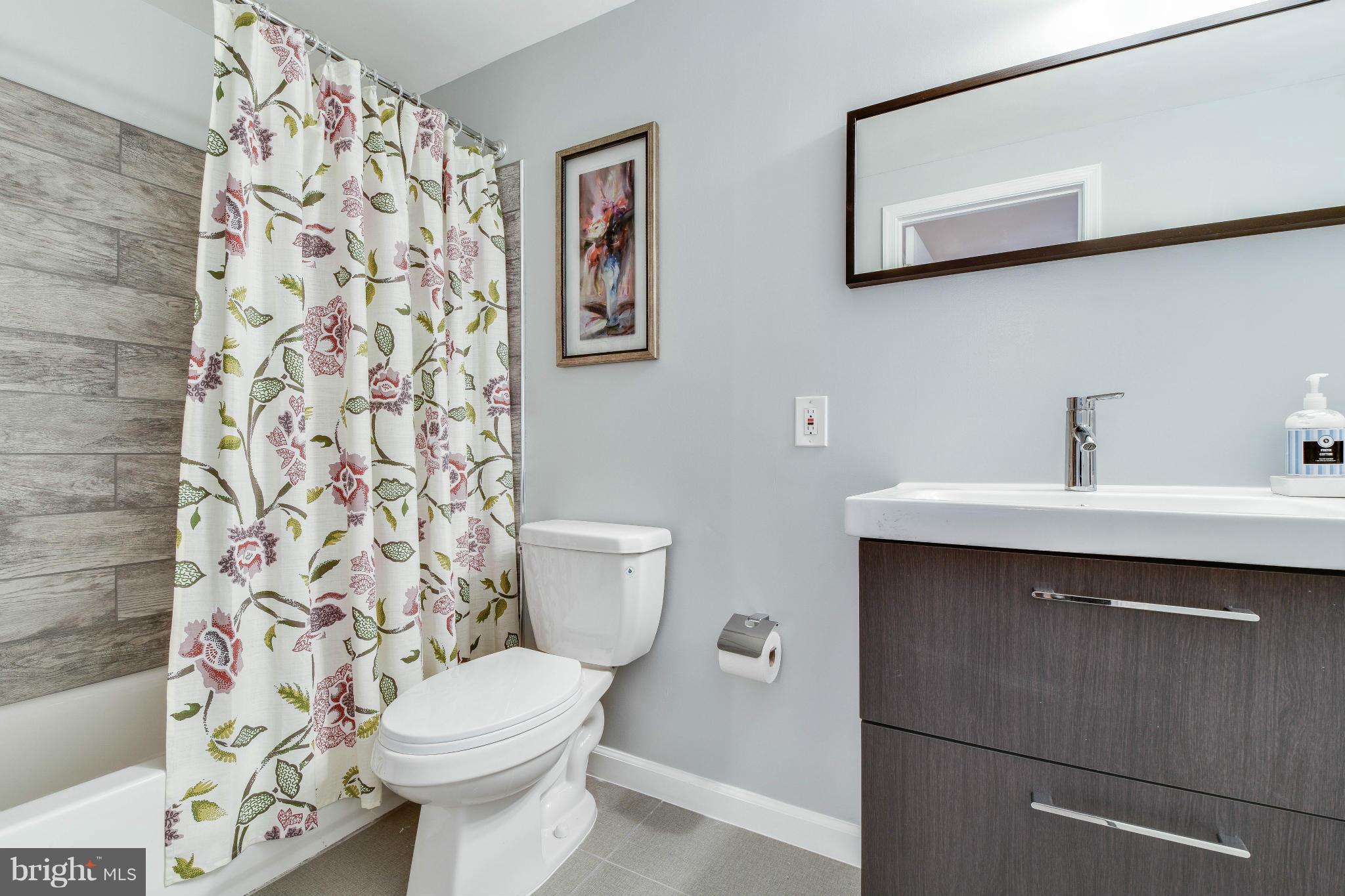 14001 Pond View Road Silver Spring, MD 20905 - Photo 18 of 30 a bathroom with a sink toilet and shower
