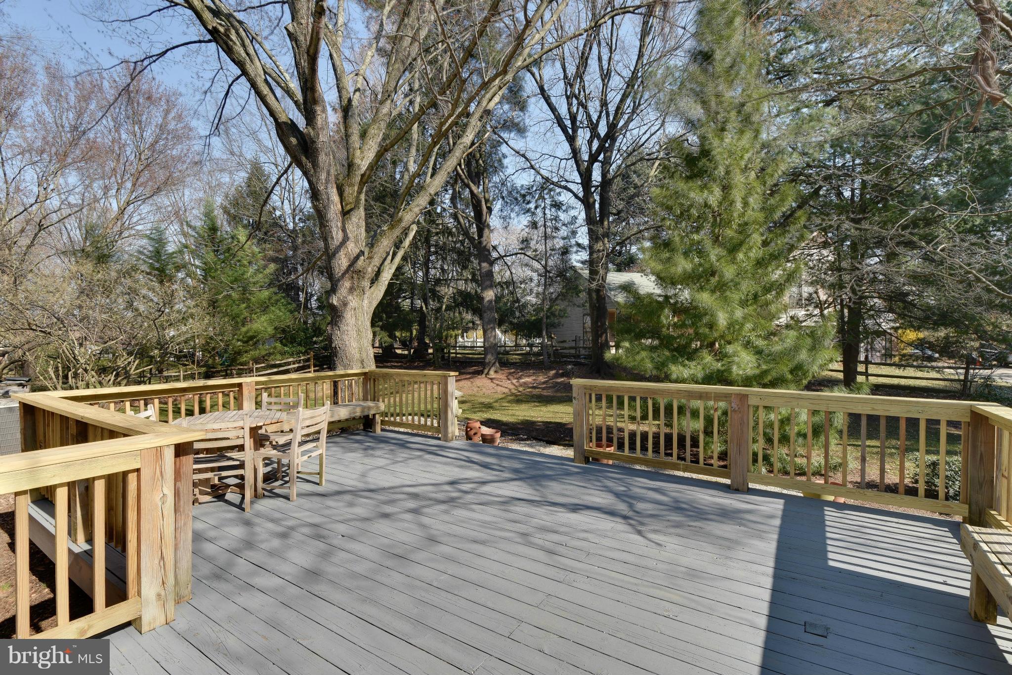 14001 Pond View Road Silver Spring, MD 20905 - Photo 26 of 30 a view of a house with wooden deck and trees