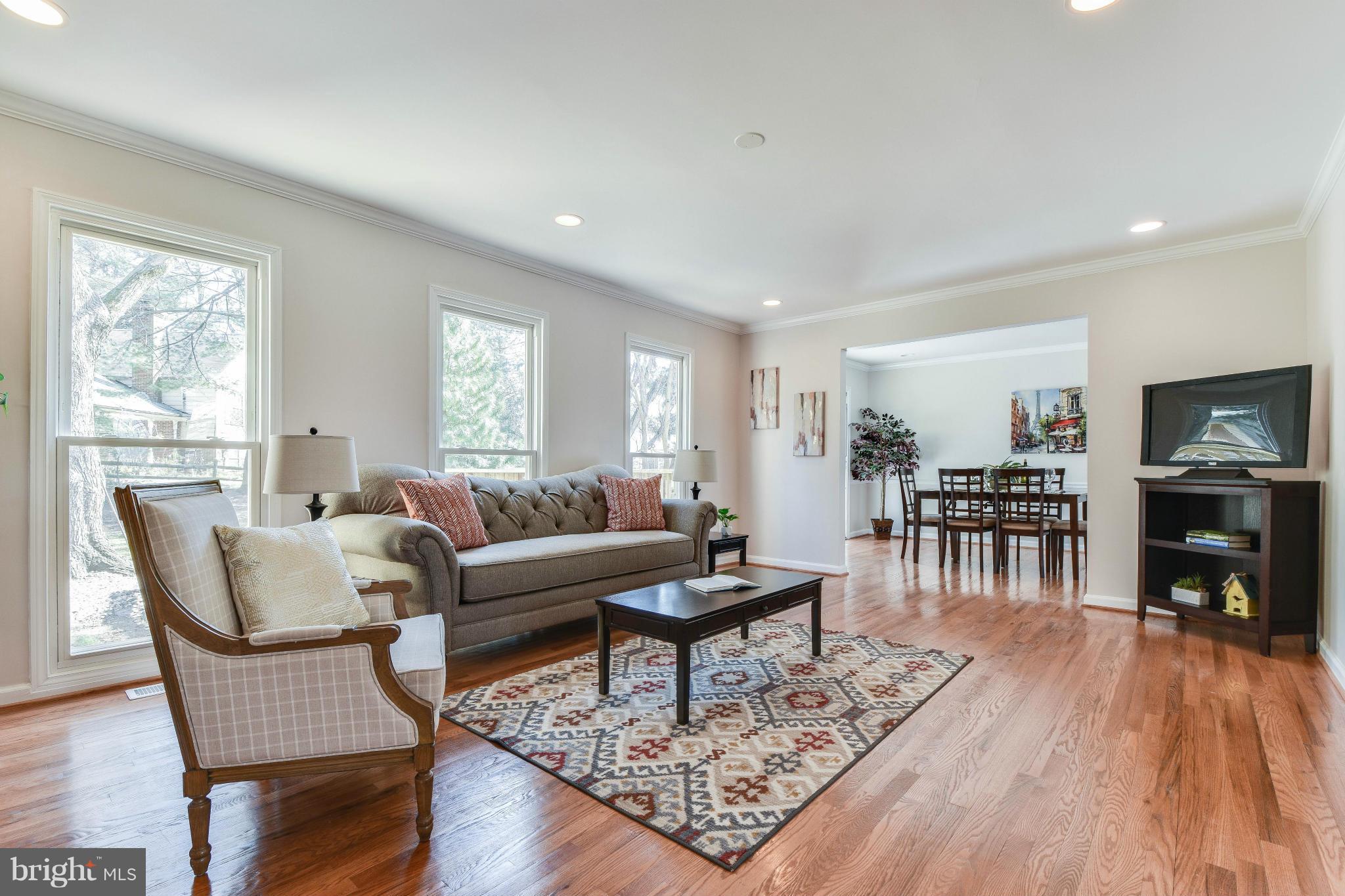 14001 Pond View Road Silver Spring, MD 20905 - Photo 4 of 30 a living room with furniture and a wooden floor