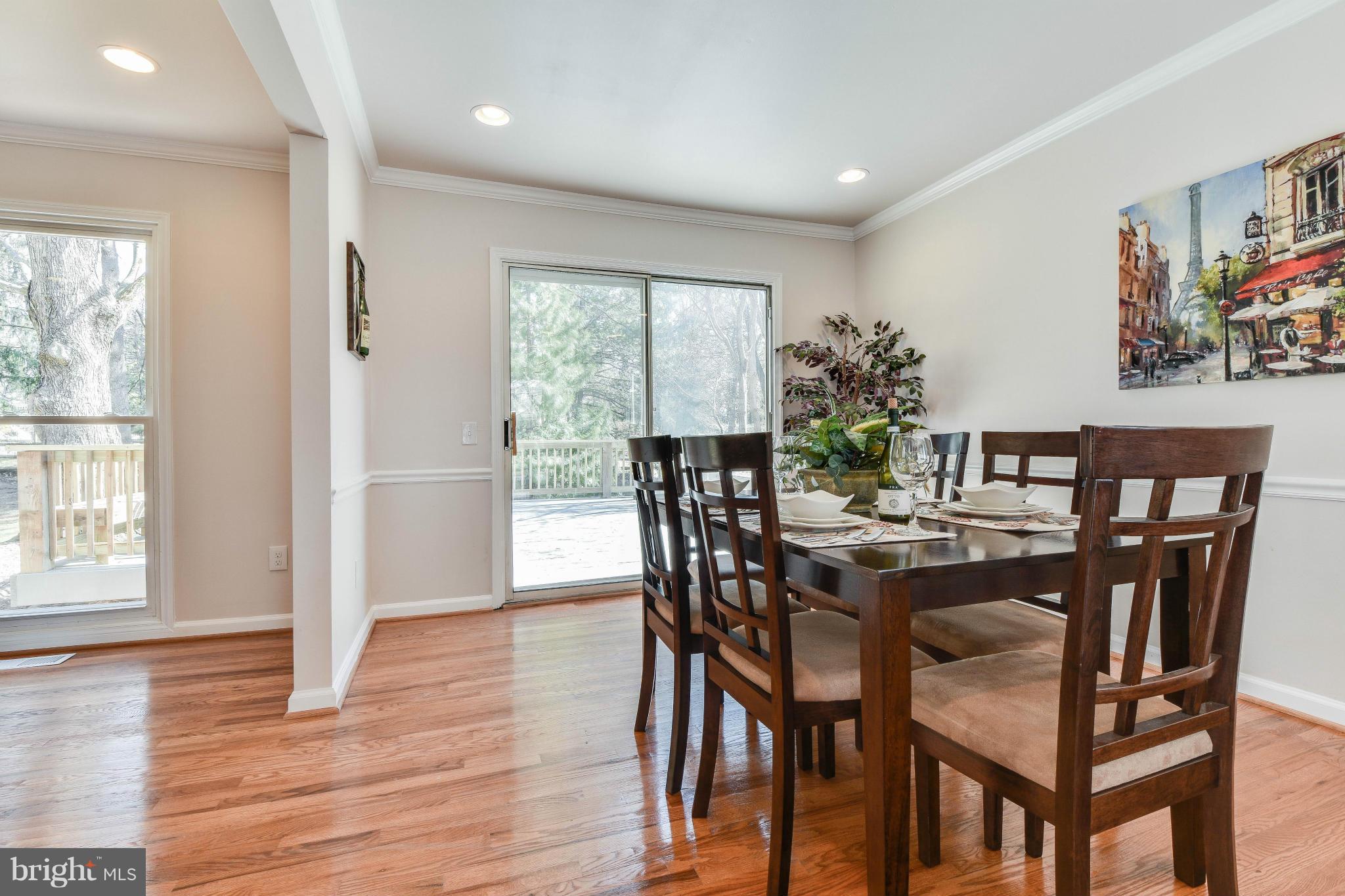 14001 Pond View Road Silver Spring, MD 20905 - Photo 5 of 30 a view of a dining room with furniture and wooden floor