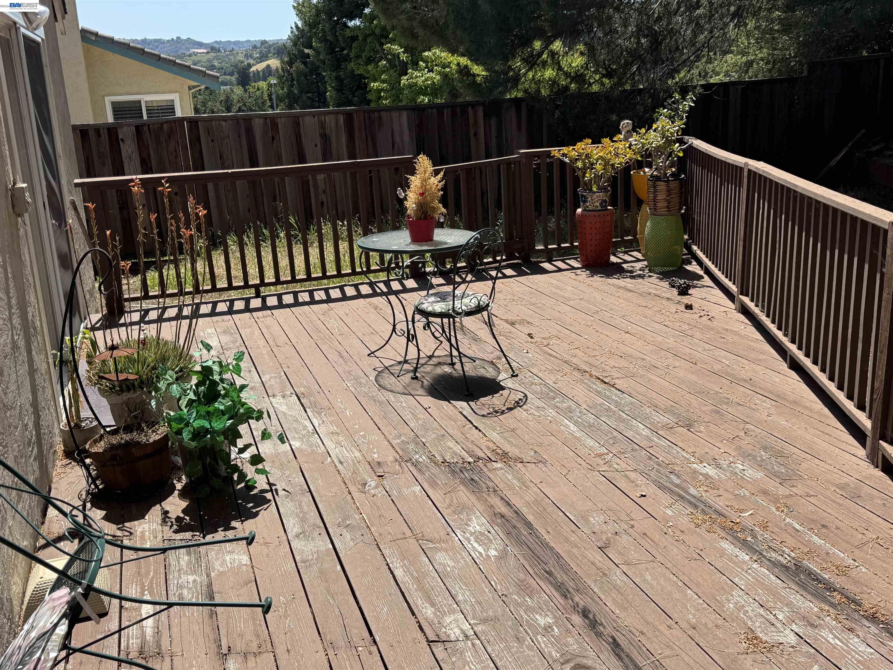 8206 Rhoda Avenue Dublin, CA 94568 - Photo 11 of 27 a view of balcony with wooden floor and outdoor seating