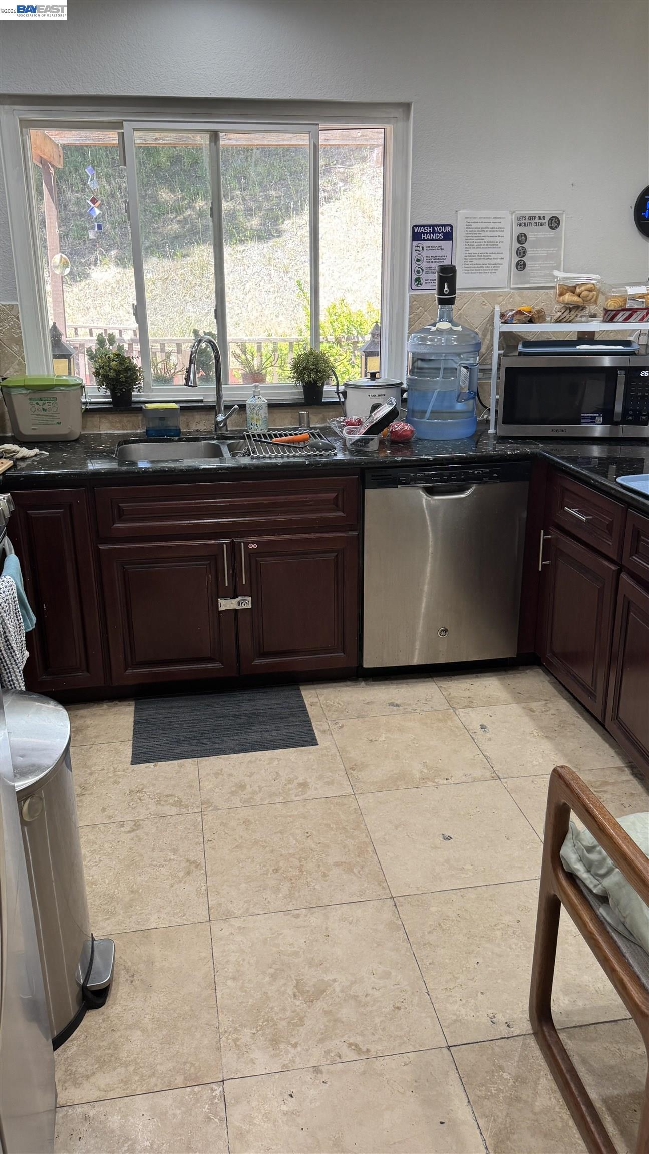 8206 Rhoda Avenue Dublin, CA 94568 - Photo 14 of 27 a kitchen with a cabinets and appliances