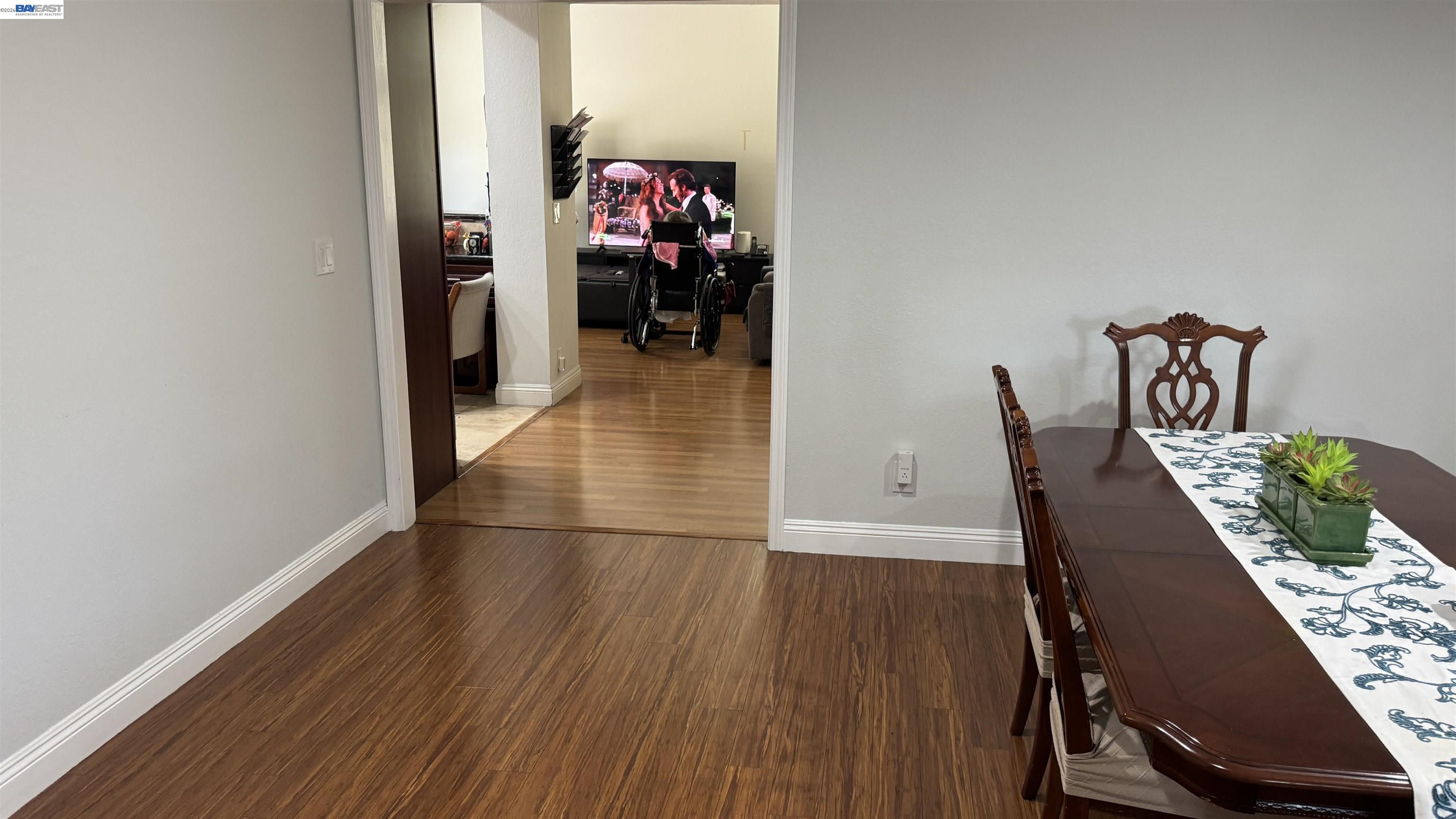 8206 Rhoda Avenue Dublin, CA 94568 - Photo 21 of 27 a view of a hallway with wooden floor and furniture