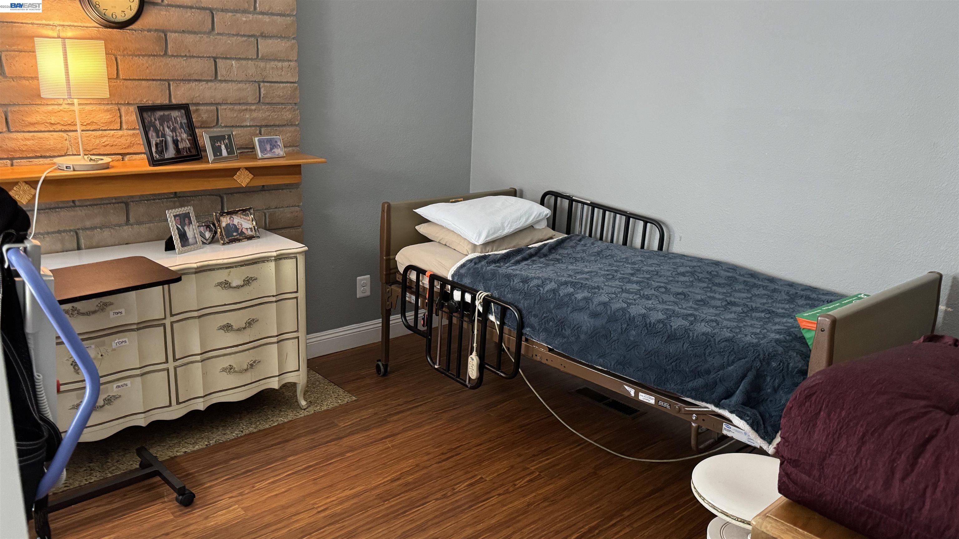 8206 Rhoda Avenue Dublin, CA 94568 - Photo 24 of 27 a bedroom with a bed and cabinets