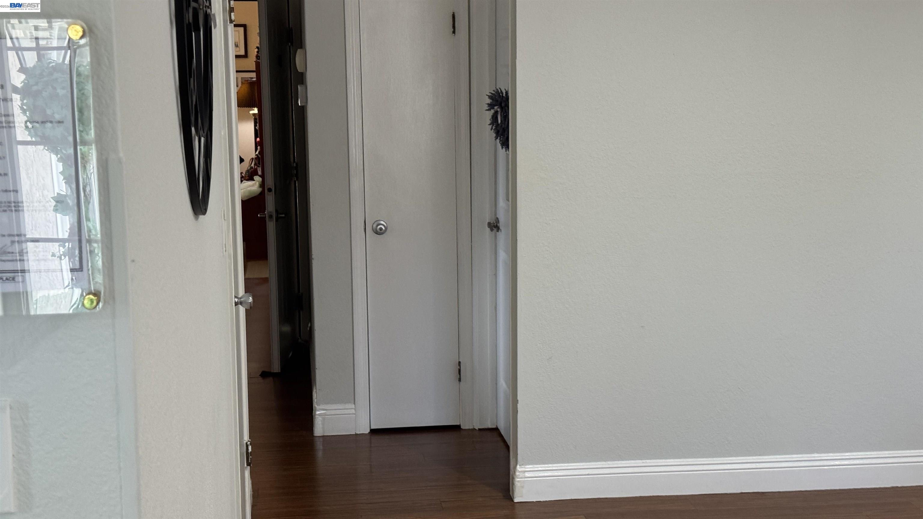 8206 Rhoda Avenue Dublin, CA 94568 - Photo 26 of 27 a view of a hallway with wooden floor