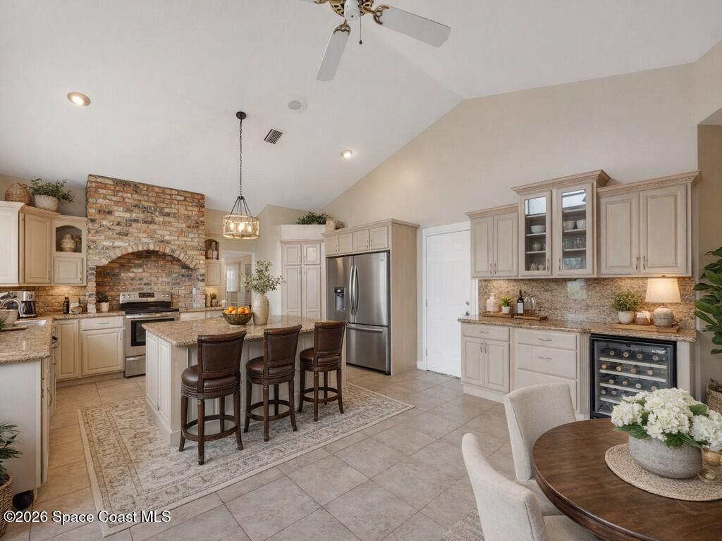 167 Deer Run Road Palm Bay, FL 32909 - Photo 14 of 36 a large kitchen with a table and chairs