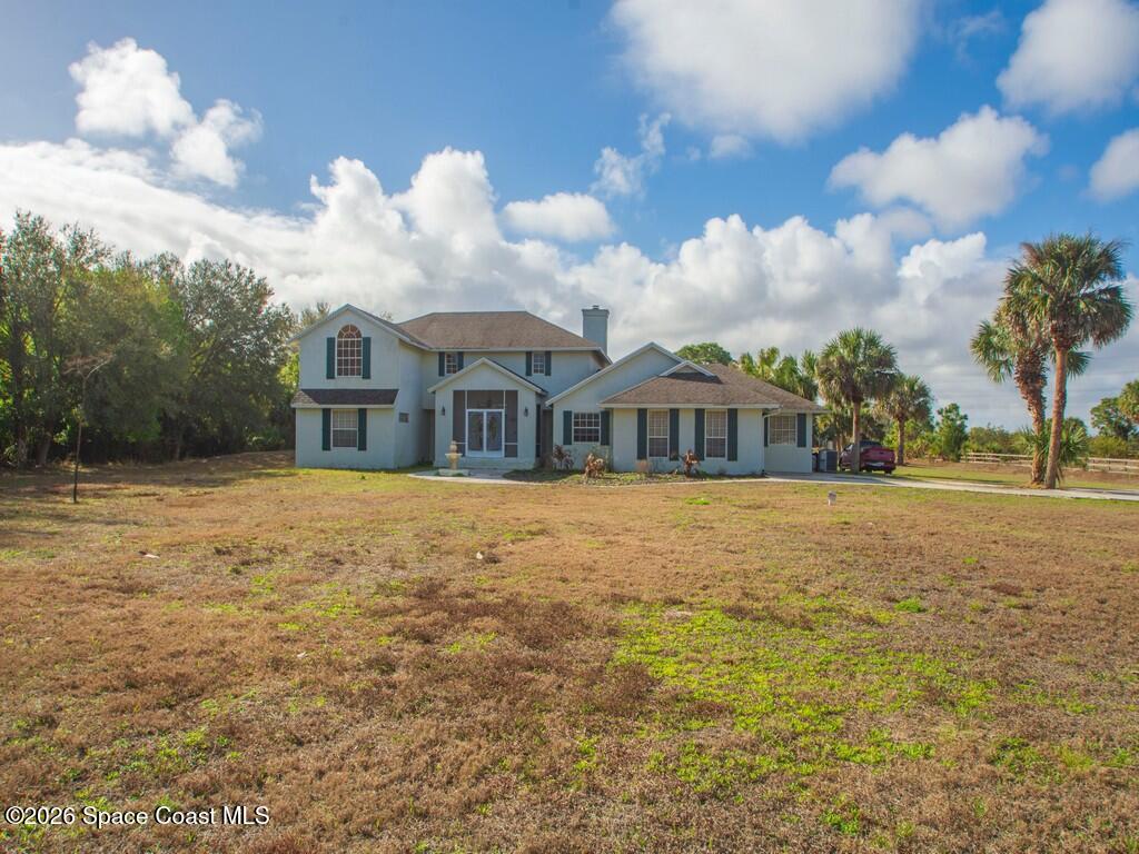 167 Deer Run Road Palm Bay, FL 32909 - Photo 5 of 36 a front view of a house with a yard