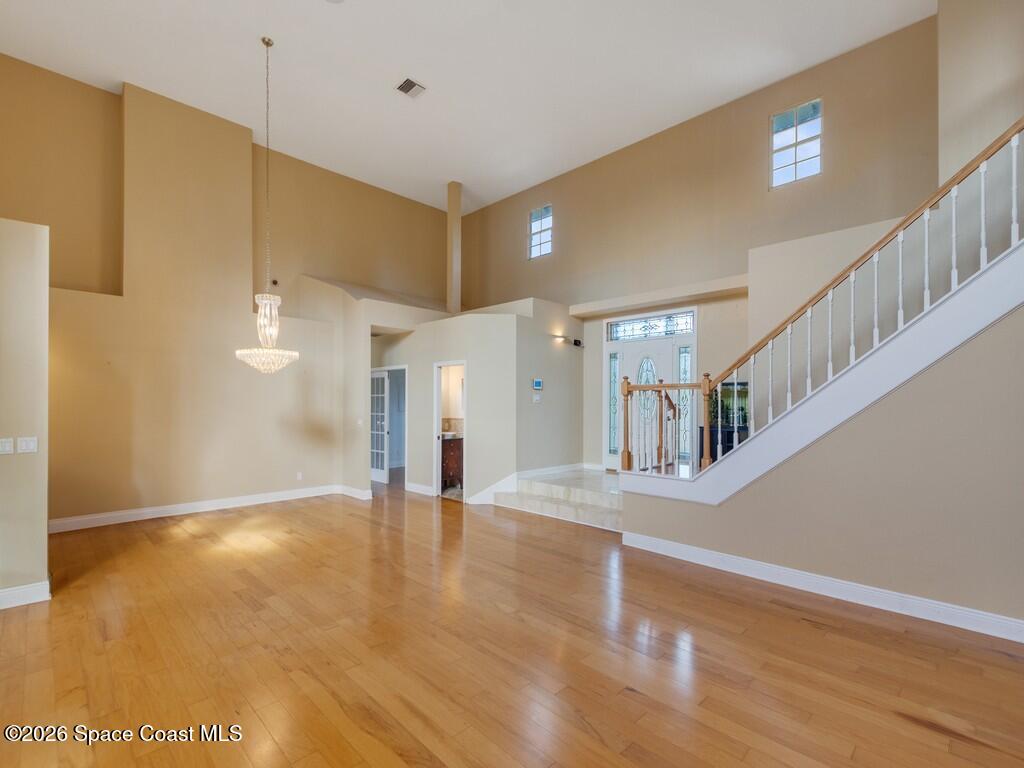 167 Deer Run Road Palm Bay, FL 32909 - Photo 7 of 36 a view of an entryway with wooden floor