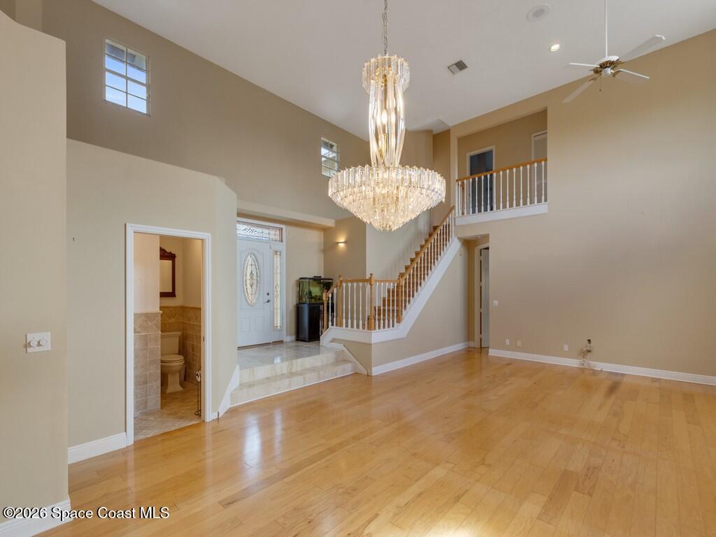 167 Deer Run Road Palm Bay, FL 32909 - Photo 8 of 36 a view of an empty room with a chandelier