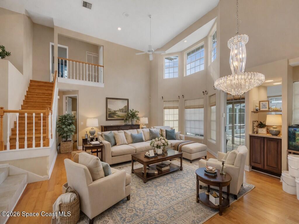 167 Deer Run Road Palm Bay, FL 32909 - Photo 10 of 36 a living room with furniture and a chandelier