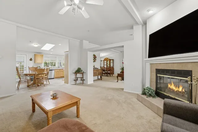 a view of a green field with trees in the background
