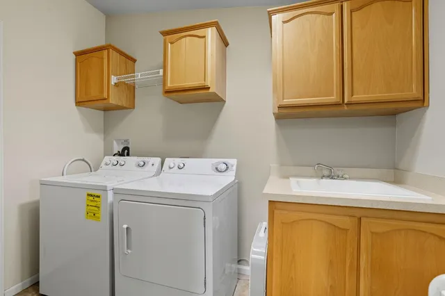 a view of a field with trees in the background