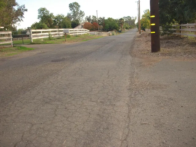 a view of a field and trees