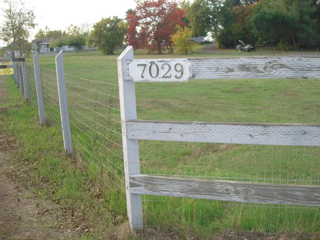 a bathroom with a tub sink shower and mirror
