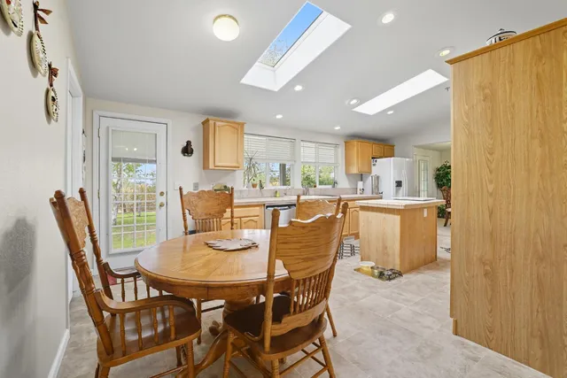 a view of a field with trees in the background