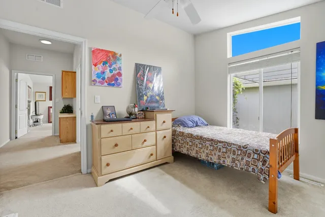 a view of house that has a small yard