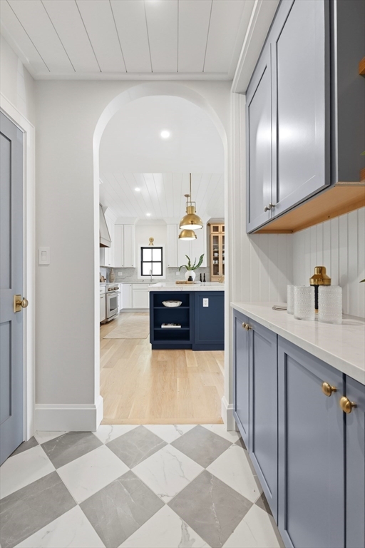 847 East 5th Street, Unit 2 Boston, MA 02127 - Photo 10 of 24 a view of a kitchen with kitchen island a sink stainless steel appliances and cabinets