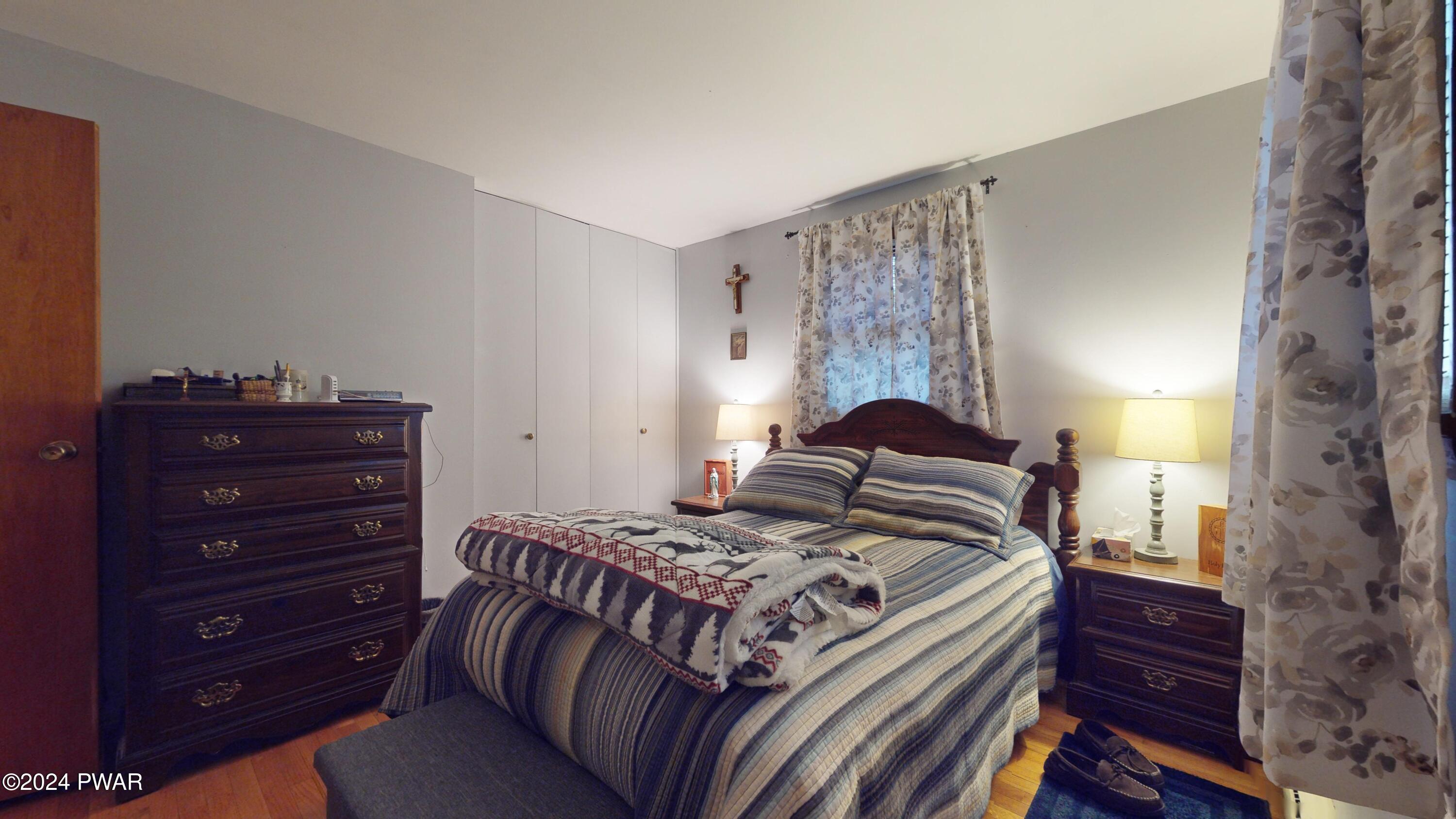 134 Sunnylands Road Milford, PA 18337 - Photo 6 of 59 a bedroom with a bed and a dresser