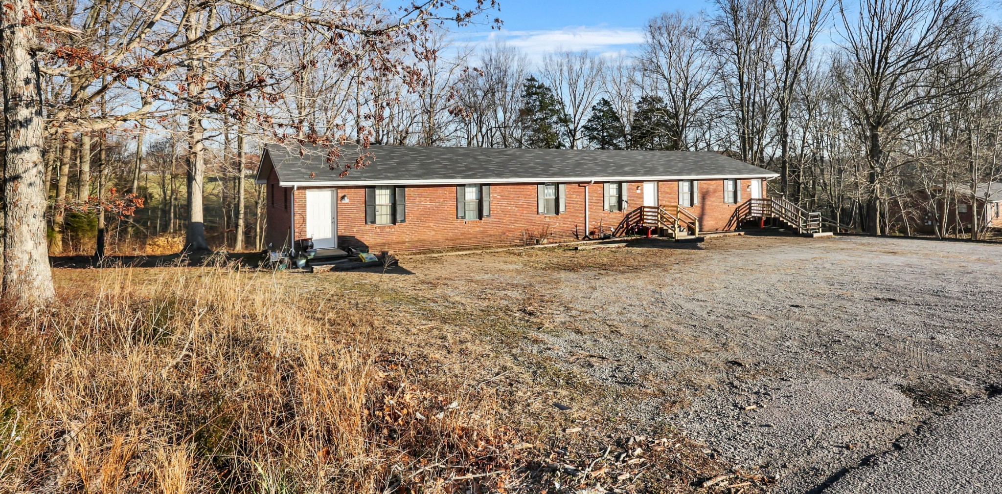 1088 Mcdaniel Road Clarksville, TN 37043 - Photo 2 of 71 a backyard of a house with barbeque oven and outdoor seating