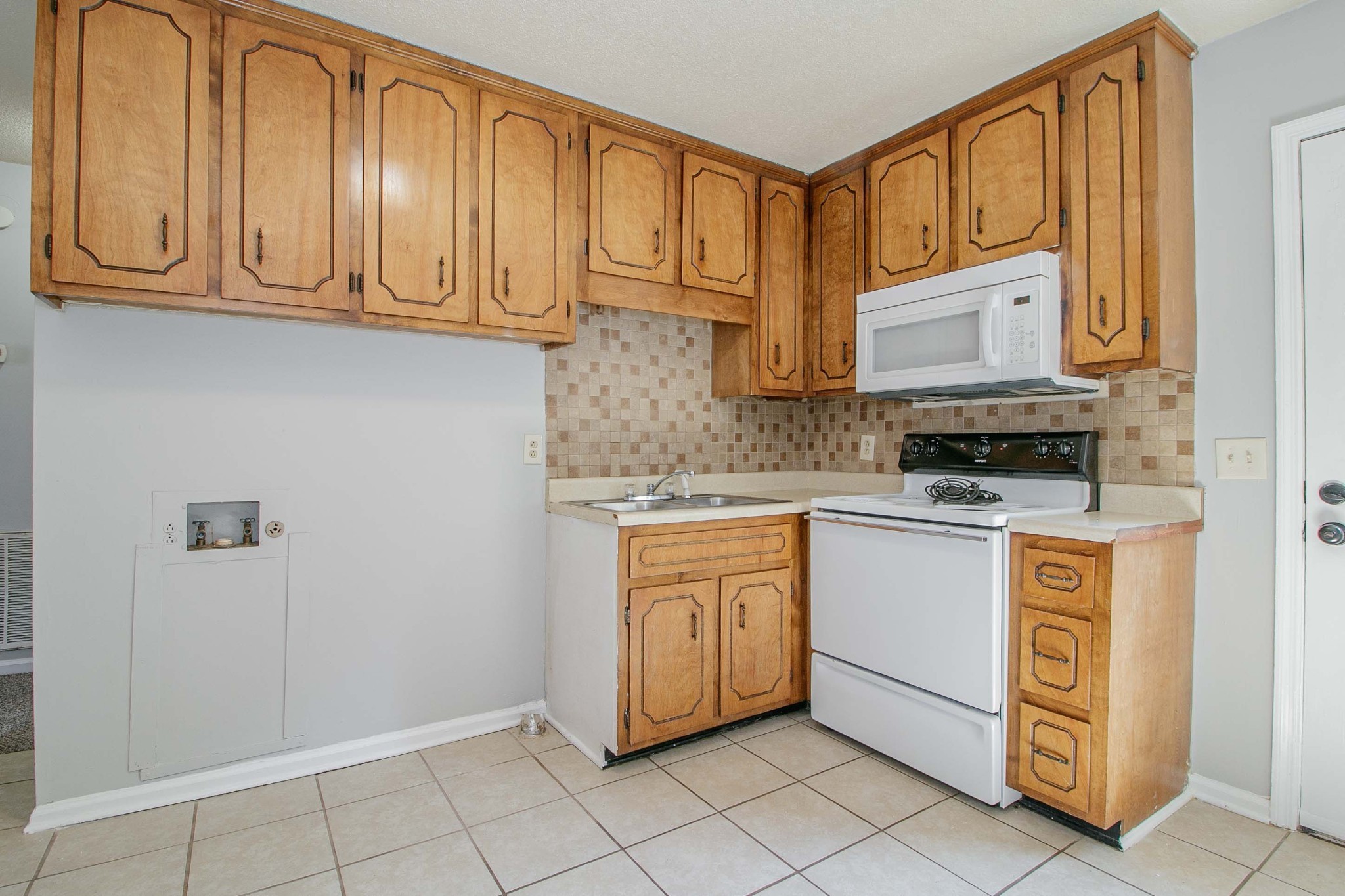 1088 Mcdaniel Road Clarksville, TN 37043 - Photo 27 of 71 a kitchen with stainless steel appliances granite countertop a stove a refrigerator and cabinets